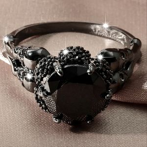 valentines day idea! venom metal round cut black gemstone cradled by skulls